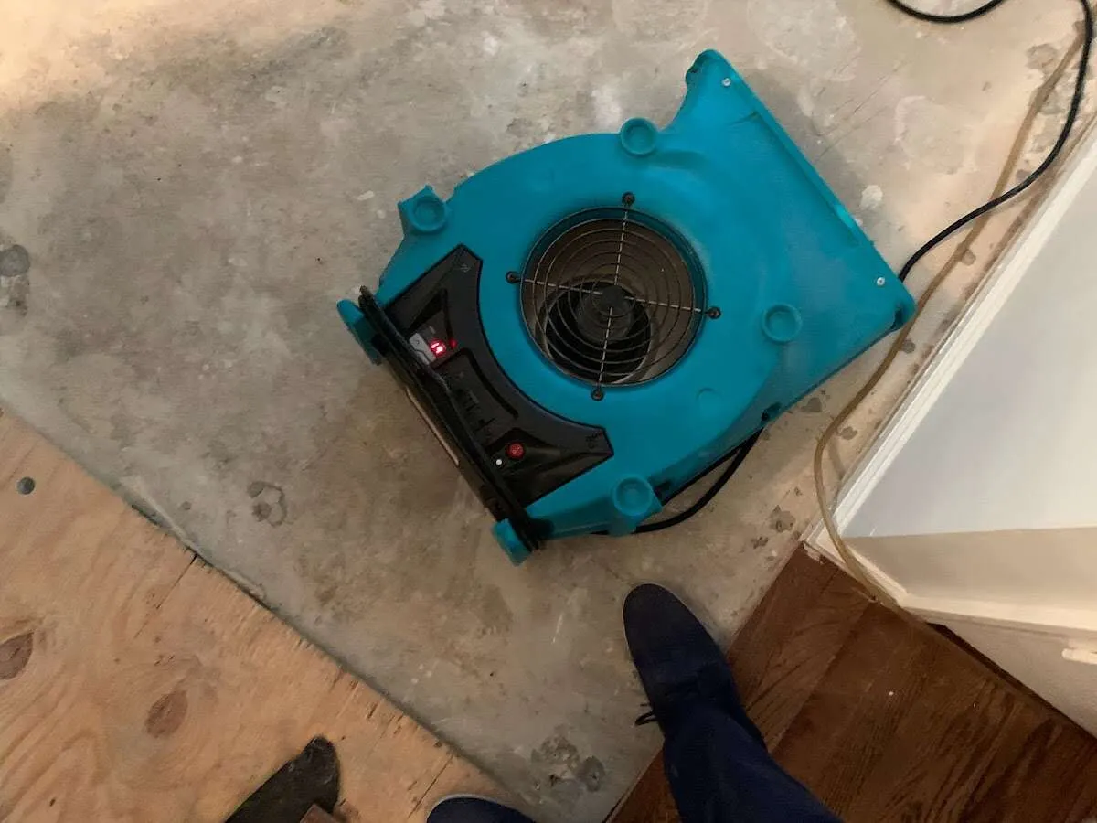 Air mover drying subfloor during Leak Detection & Repair in Vinings